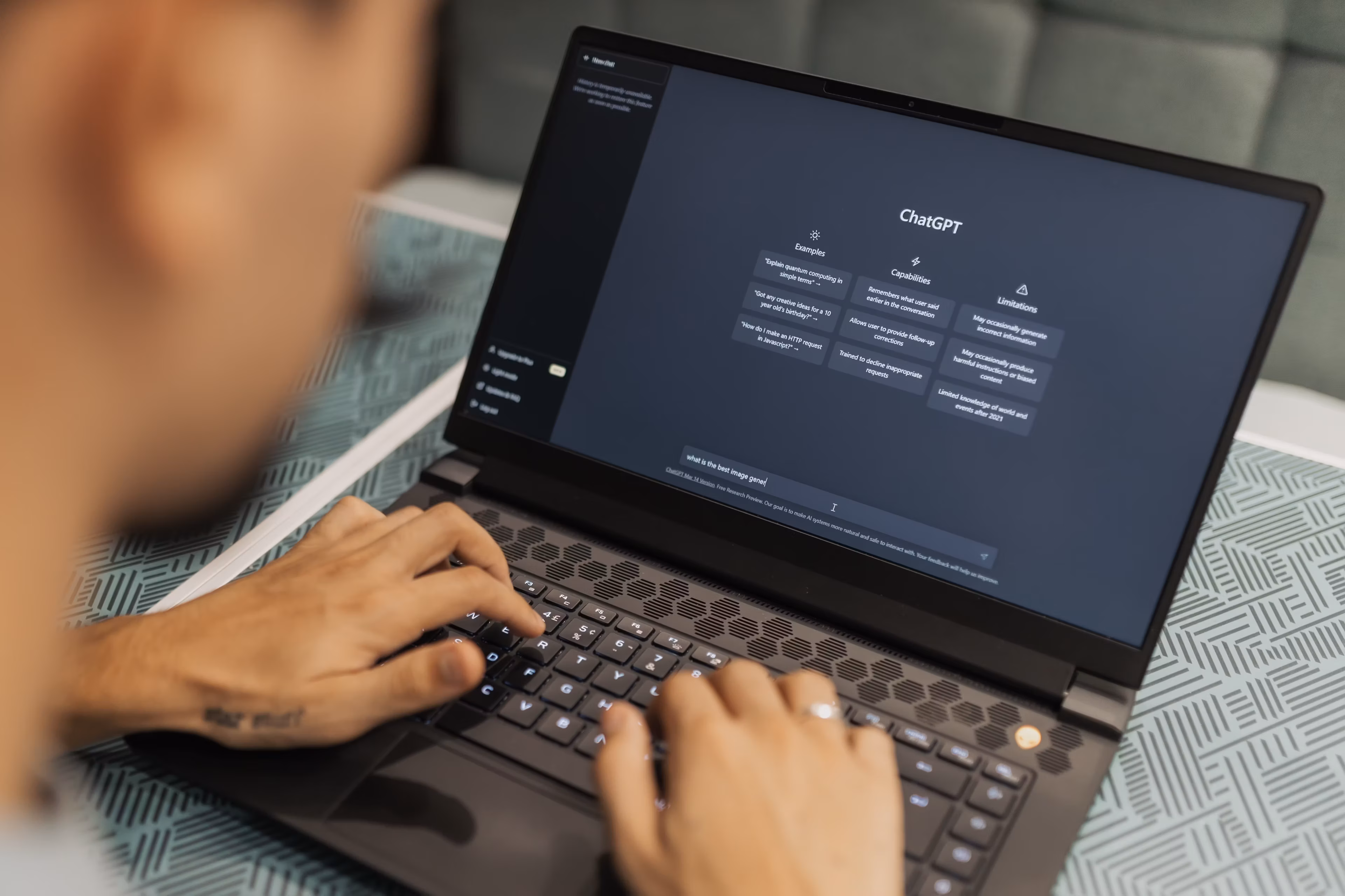 Laptop showing an AI chat interface — paste a YouTube transcript and summary prompt to summarize a video
